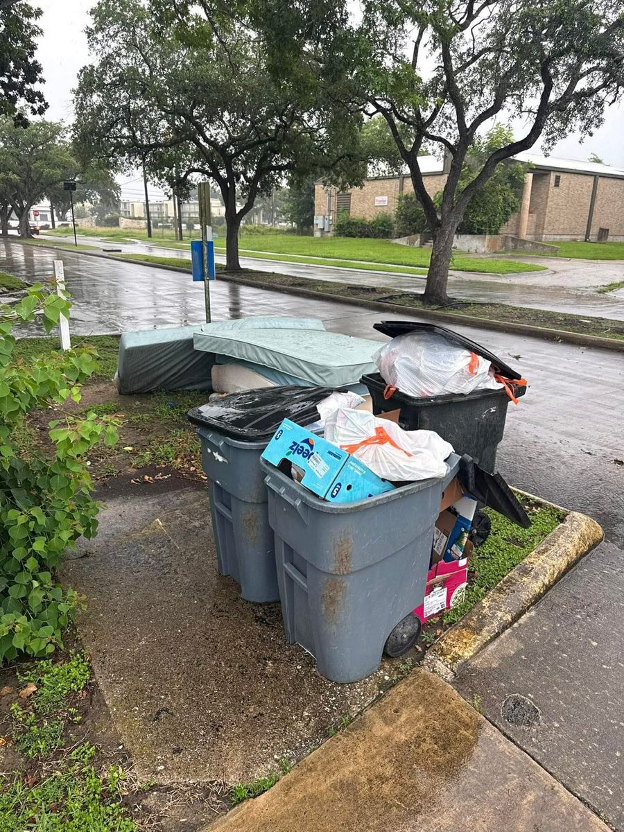Curbside pile of junk and debris ready for pickup