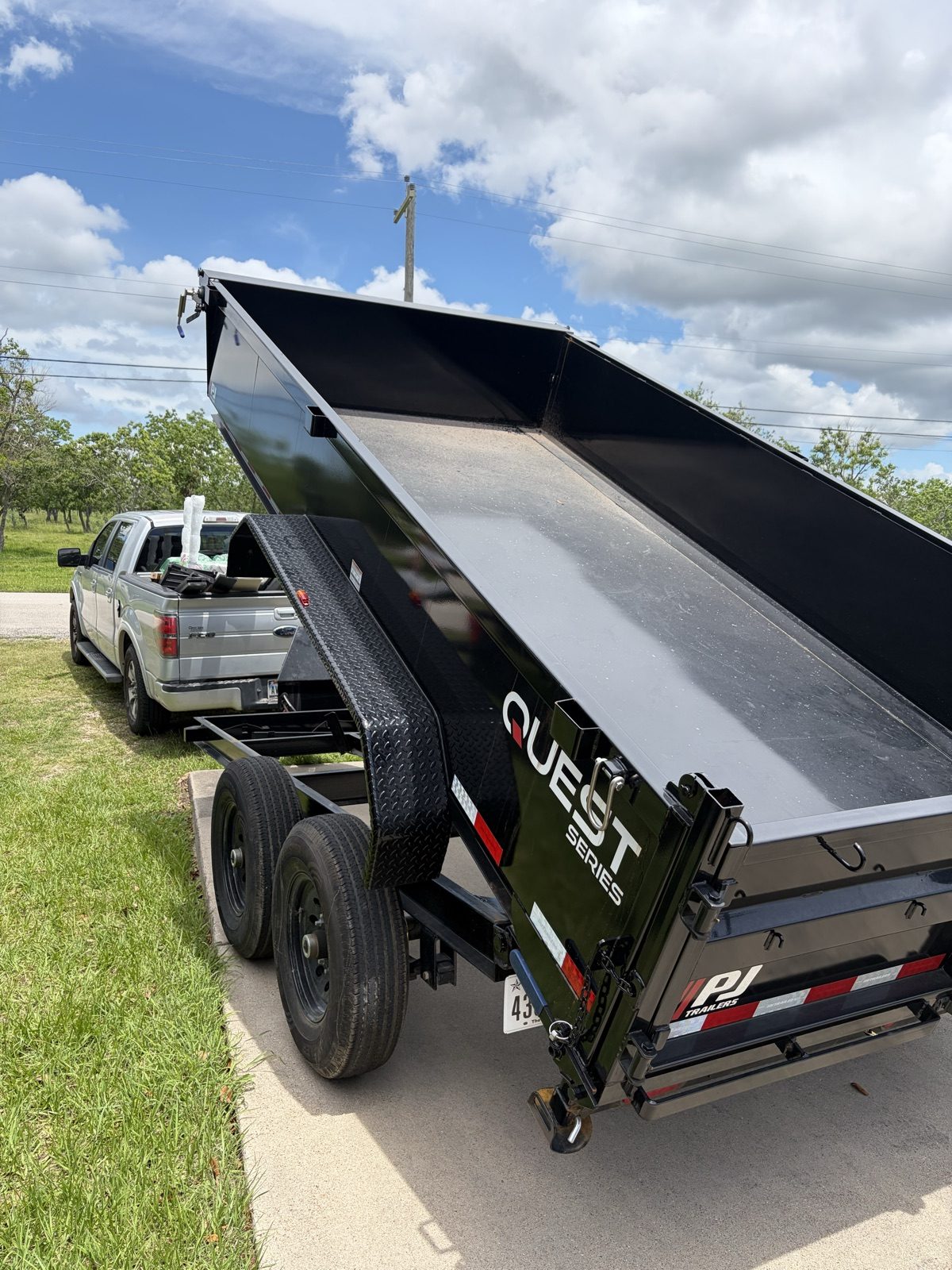H&L dump trailer unloading on a residential job in Texas