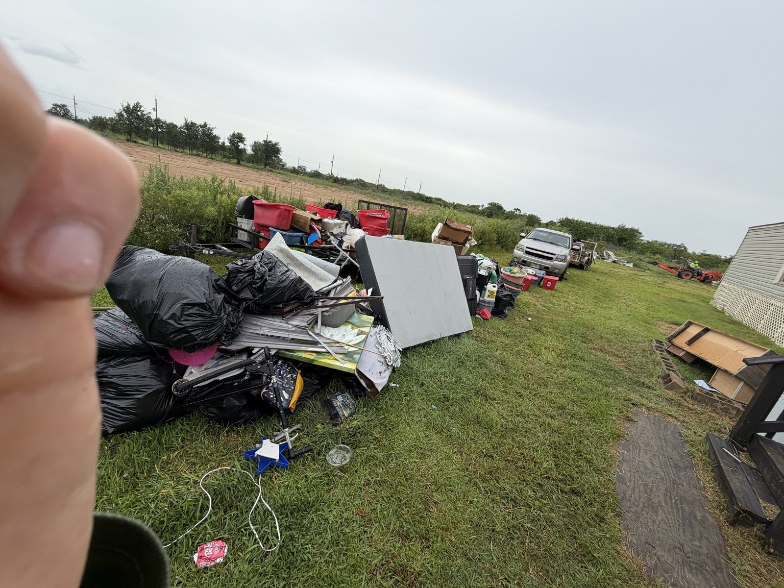 Loading a pile of junk and debris for removal